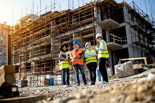 Four construction workers having meeting,stock photo